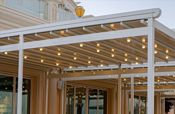Circular spot lights placed on aluminium profile of a retractable roof.