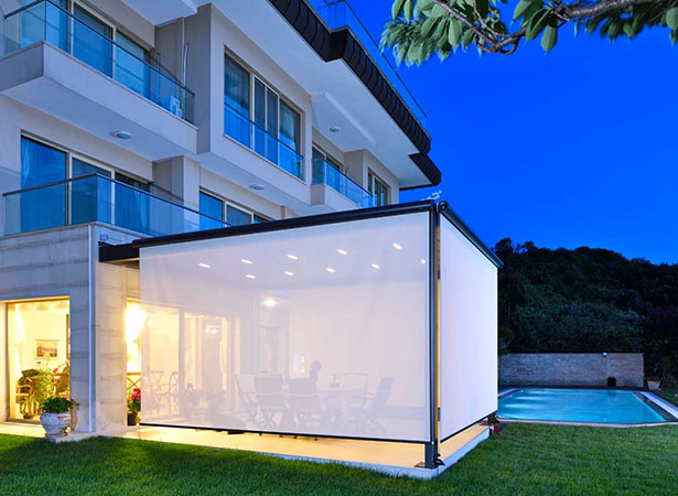 White vertical blind covering an outdoor living space