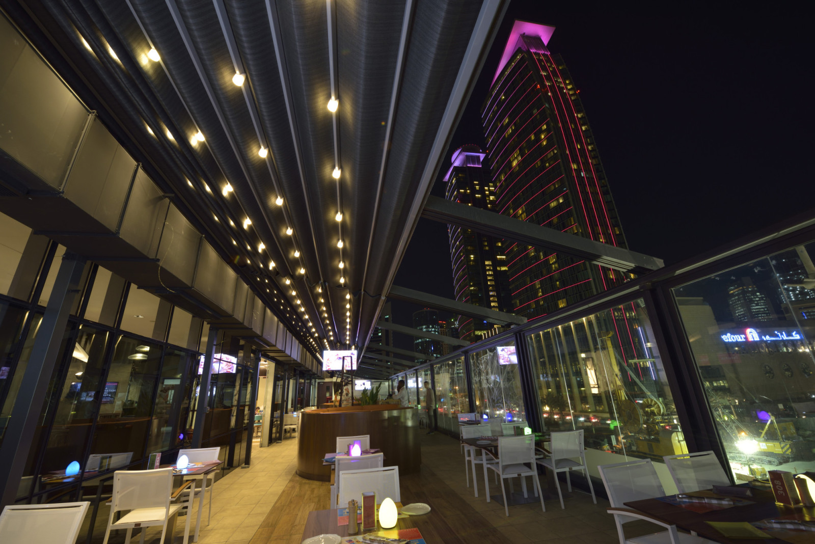 The Captivating Fusion of Silver Fabric Pergola and Insulated Glass Systems at Eatopia, Doha, Qatar